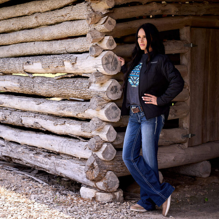 Ariat Women's Black Crius Insulated Western Jacket displayed outdoors, featuring a stylish design with warm quilted insulation.