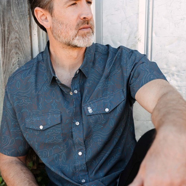 Raised By Coyotes Men's Cowboy Threads Pearl Snap Short Sleeve Shirt