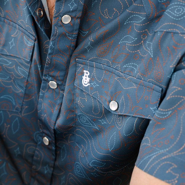 Raised By Coyotes Men's Cowboy Threads Pearl Snap Short Sleeve Shirt