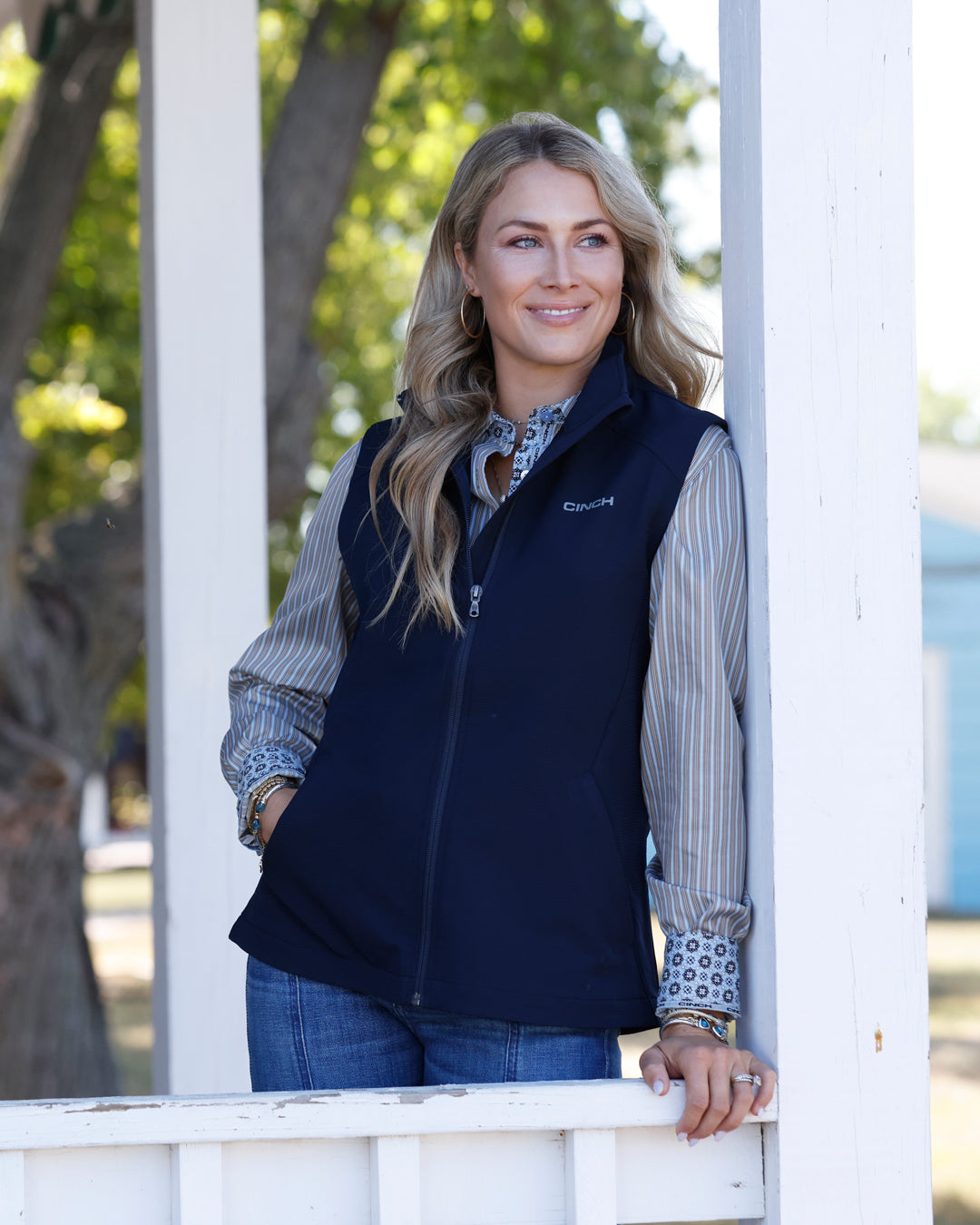 Cinch Women's navy windproof vest for western wear, with a front zipper and quilted design, suitable for outdoor western style.