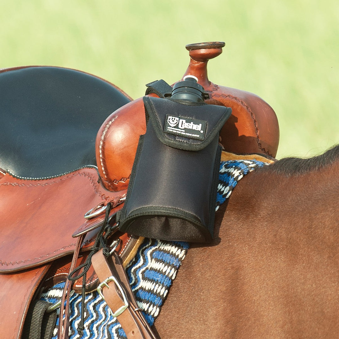 Black Cashel saddle bag water bottle holder attached to a horse saddle for easy hydration during riding.