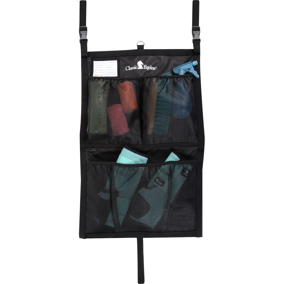 Classic Equine stall front grooming bag with multiple compartments and tools for horse grooming and maintenance.