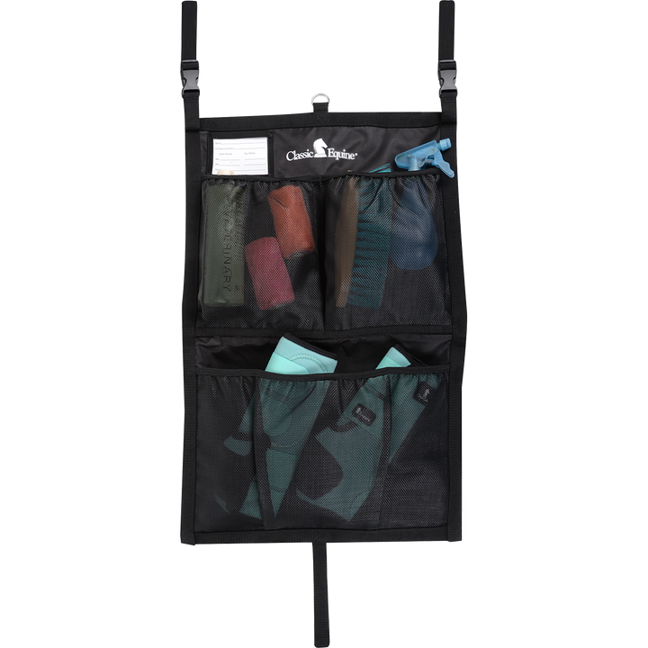 Classic Equine stall front grooming bag with multiple compartments and tools for horse grooming and maintenance.